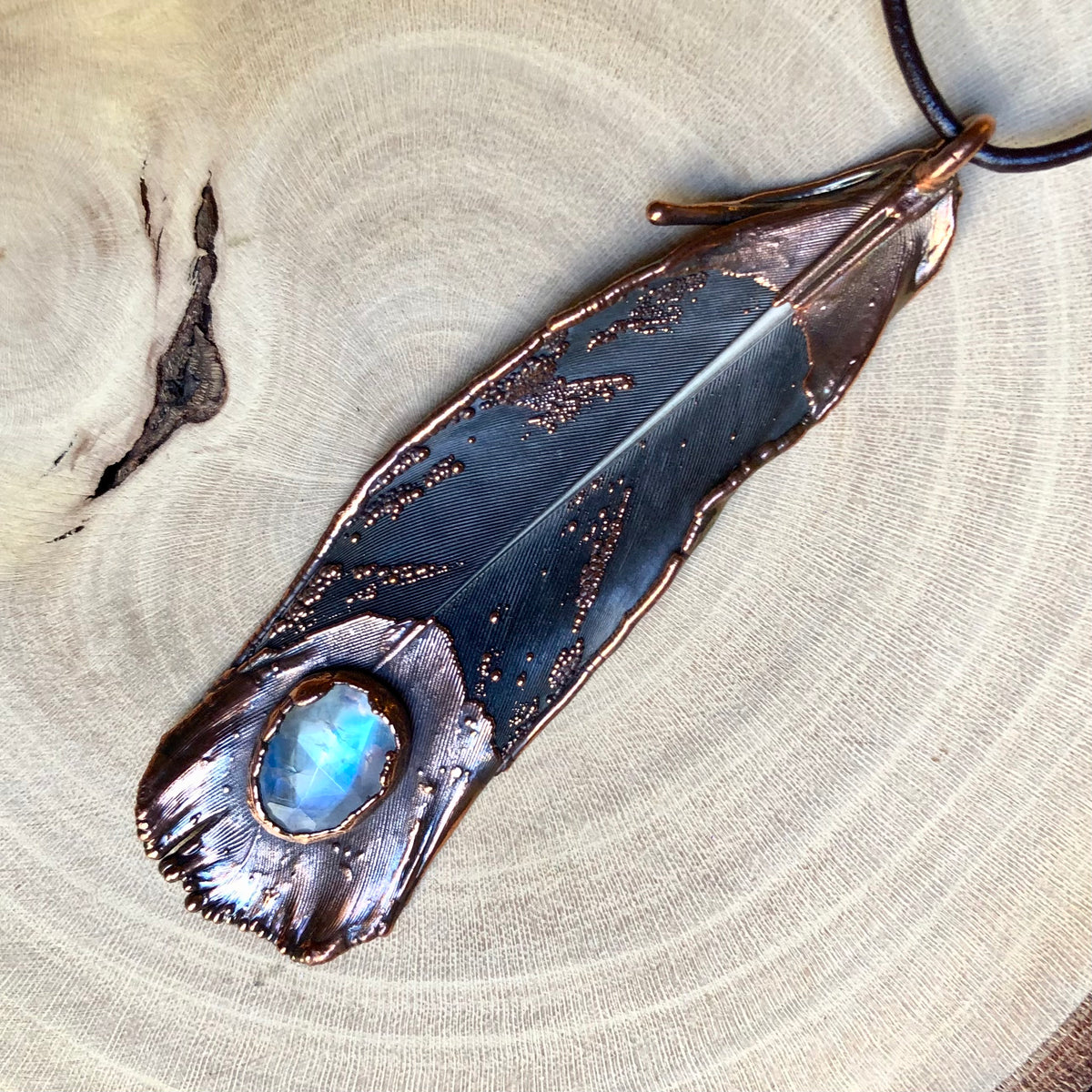 MOONSTONE ON PIGEON FEATHER