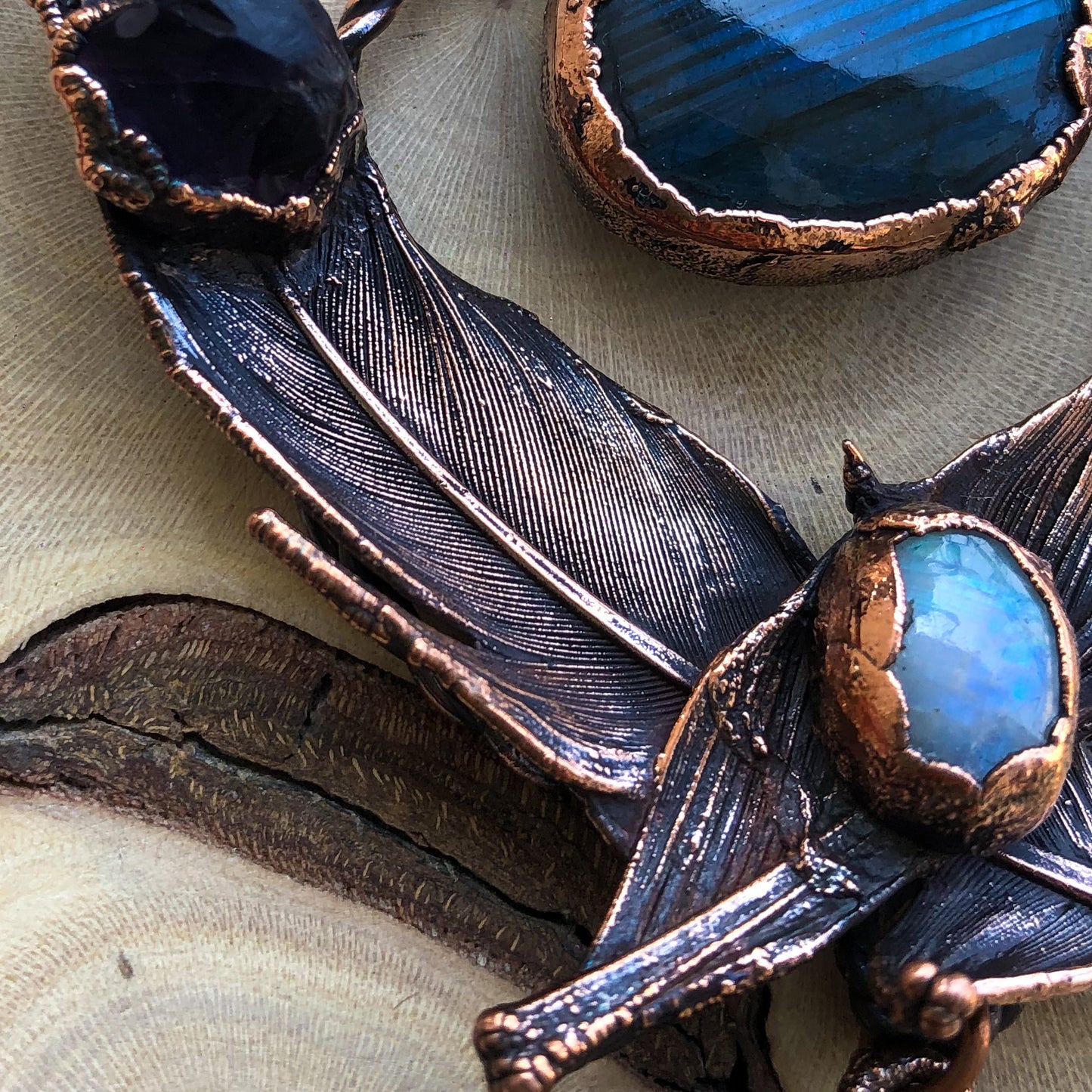 LABRADORITE, MOONSTONE, LEMURIAN QUARTZ & AMETHYST ON PIGEON FEATHERS