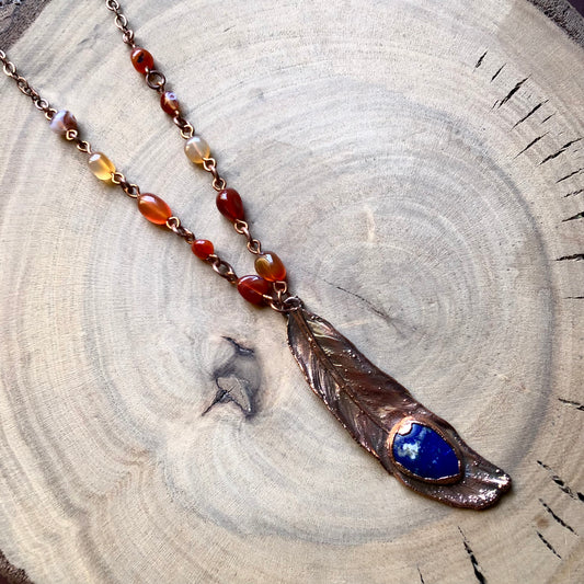 LAPIS LAZULI ON PIGEON FEATHER & CARNELIAN