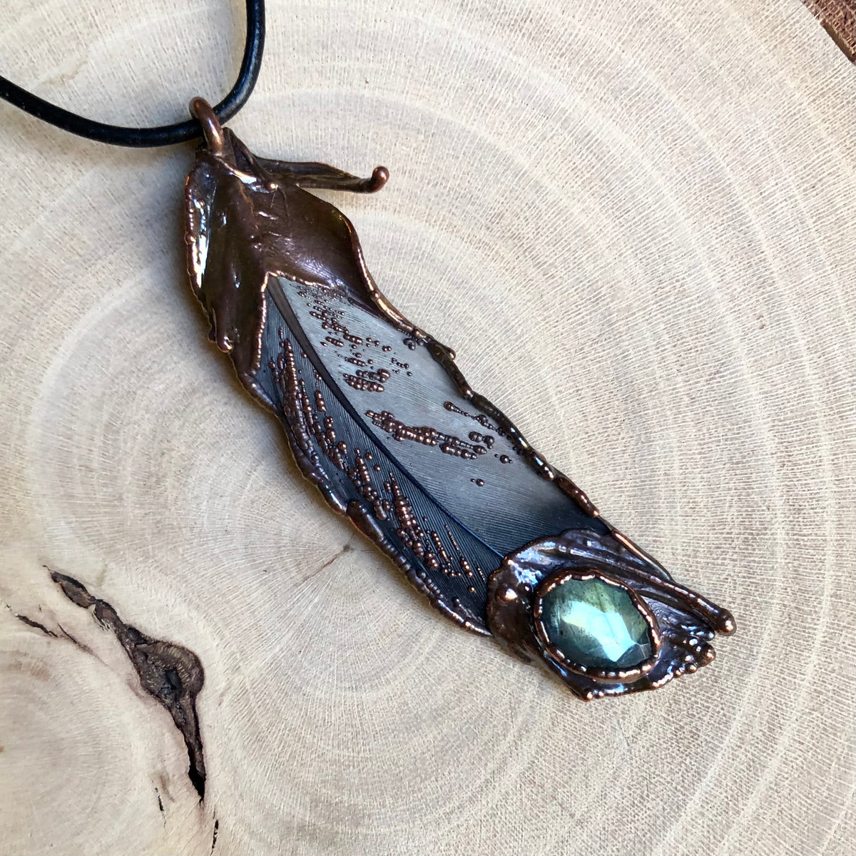 LABRADORITE ON PIGEON FEATHER