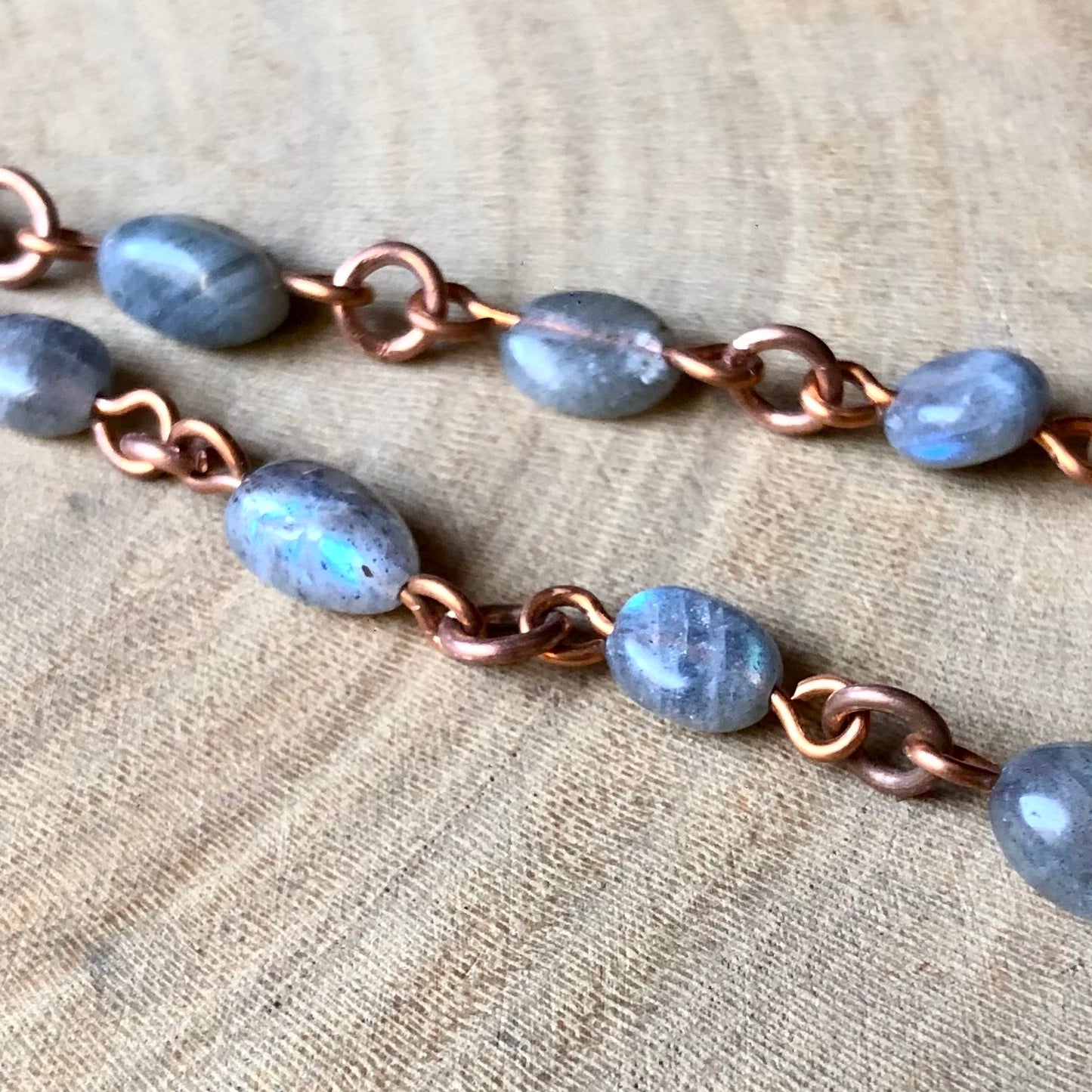 LABRADORITE ON PIGEON FEATHER