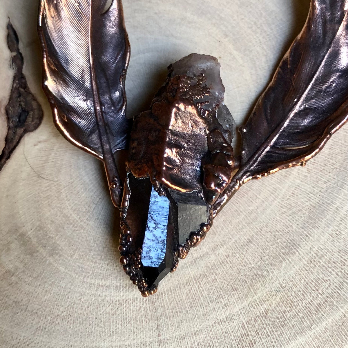 ST. CATHERINE’S SMOKY QUARTZ, TIGER EYE, GREEN GARNET & PIGEON FEATHERS